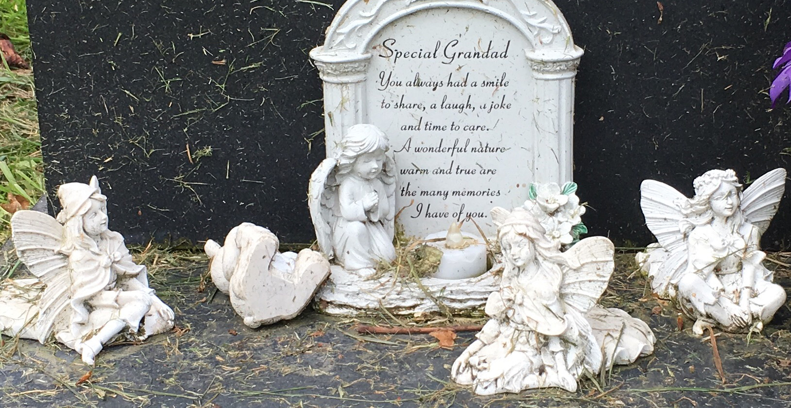 Fairy figurines on a grave