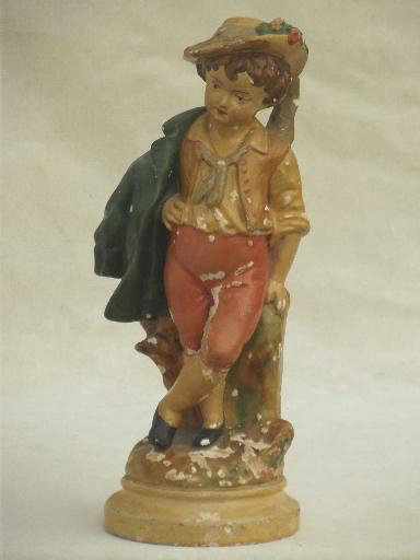 A plaster of Paris figurine of a shepherd boy
